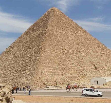 The Khufu Pyramid, also known as the Great Pyramid of Giza, a massive ancient stone pyramid with a square base and four triangular faces.