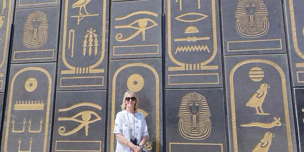 Pharaonic murals decorating the walls of the Grand Egyptian Museum.