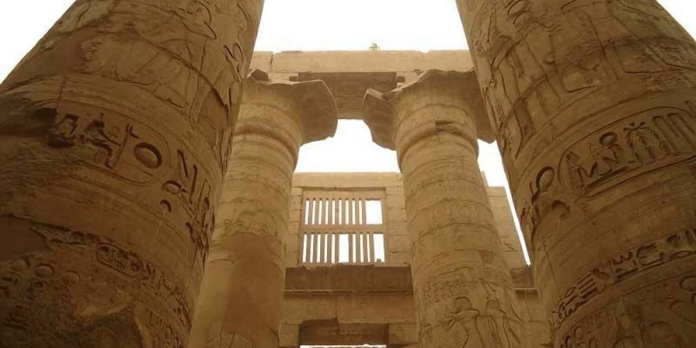 Columns of Karnak Temple decorated with intricate Pharaonic carvings