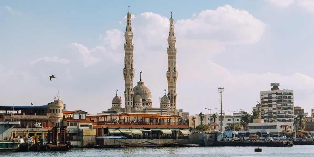 View of the Grand Mosque in Port Fouad with decorative elements adorning its twin minarets.