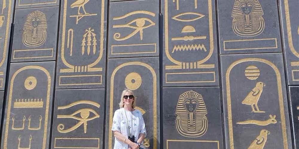 Pharaonic murals decorating the walls of the Grand Egyptian Museum.