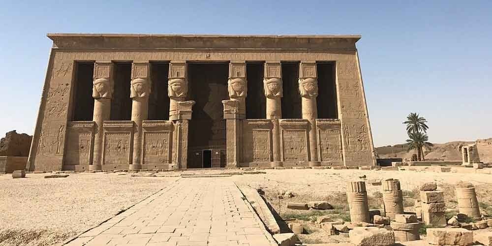 Dendera Temple of Hathor from the outside, featuring its massive columns crowned with the head of Hathor.