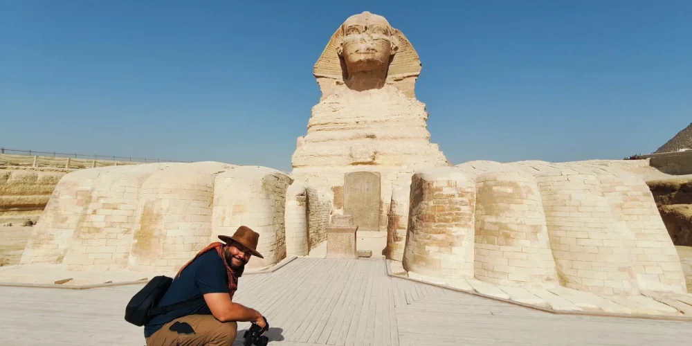 A tourist takes a photo from inside the Great Sphinx.
