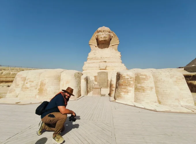 A tourist takes a photo from inside the Great Sphinx.