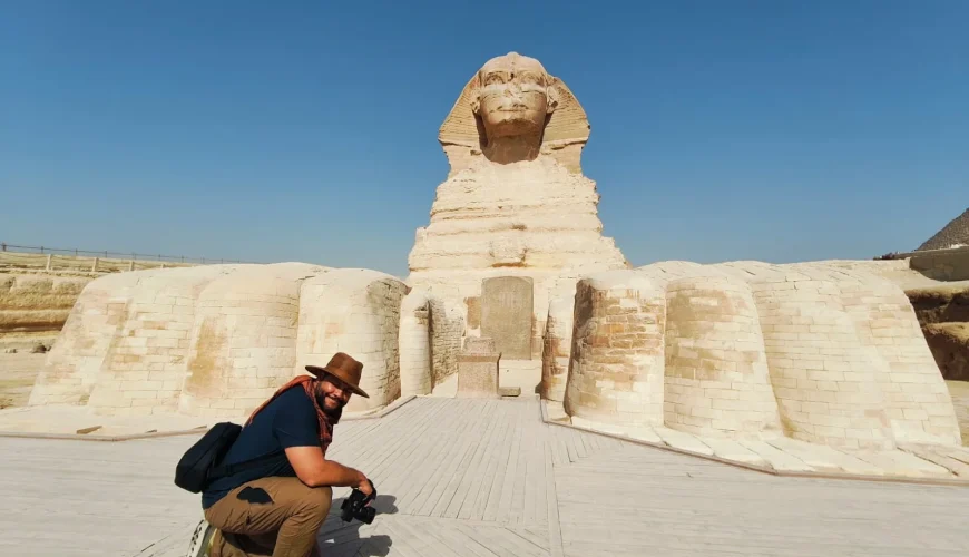 A tourist takes a photo from inside the Great Sphinx.