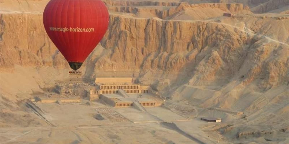 Hot air balloon flying over Queen Hatshepsut Temple in Luxor