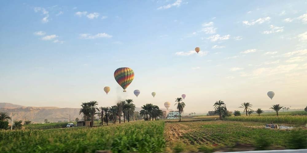 A beautiful and wonderful sky over Luxor filled with colorful hot air balloon