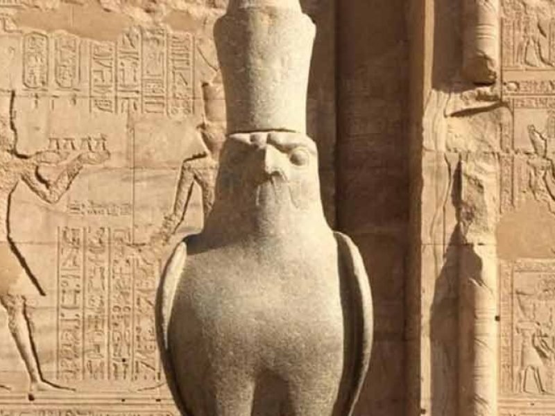 Statue of the god Horus guarding the entrance of Edfu Temple