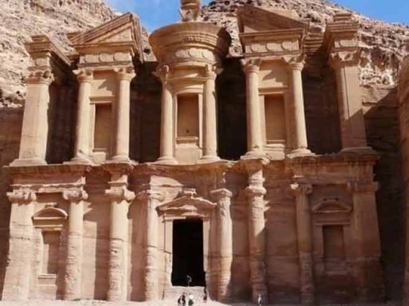 Petra in Jordan is an ancient city carved into red sandstone cliffs, famous for its Rose City architecture