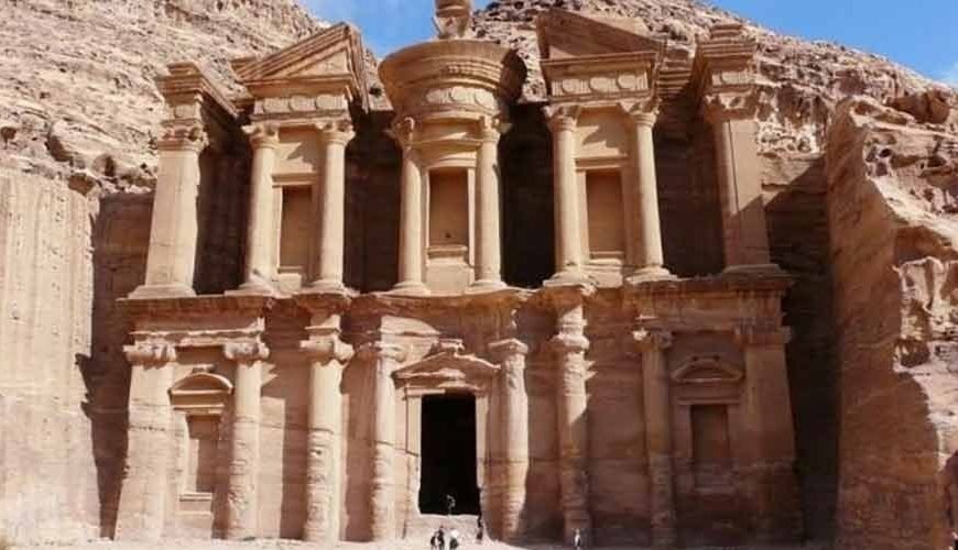 Petra in Jordan is an ancient city carved into red sandstone cliffs, famous for its Rose City architecture
