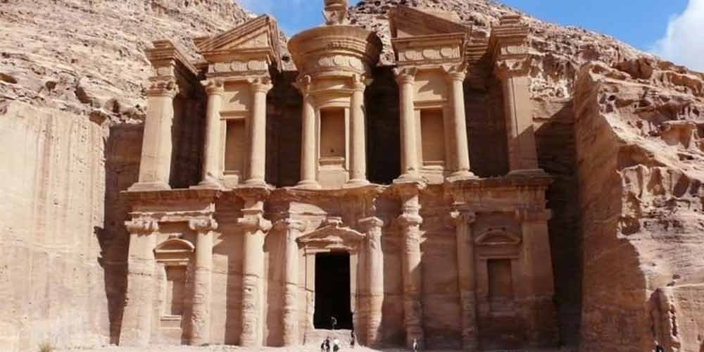 Petra in Jordan is an ancient city carved into red sandstone cliffs, famous for its Rose City architecture