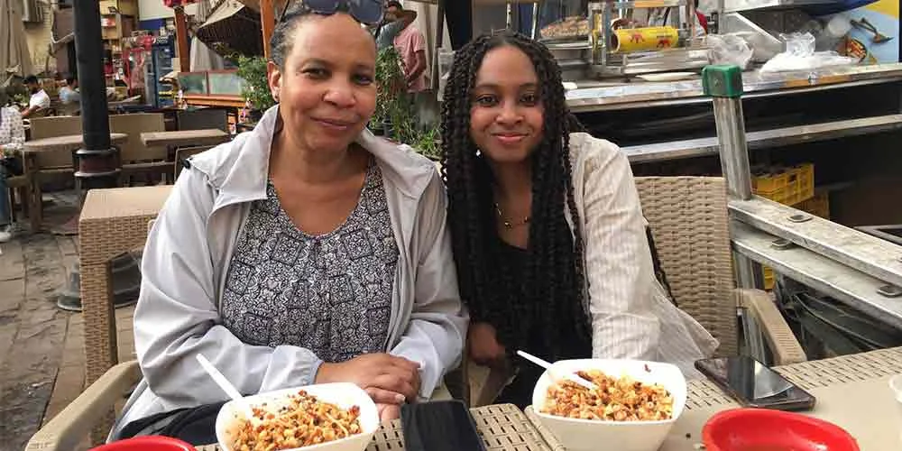 family tasting koshari, Egypt’s famous traditional dish, during their food tour in Cairo