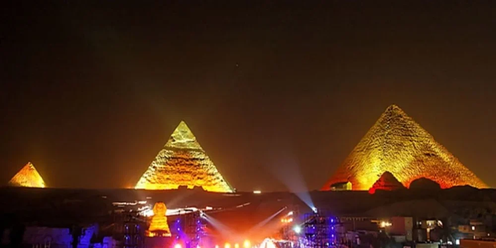 The Pyramids of Giza illuminated at night during the Sound and Light Show