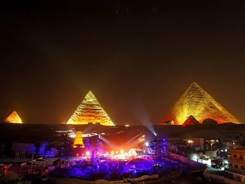 The Pyramids of Giza illuminated at night during the Sound and Light Show