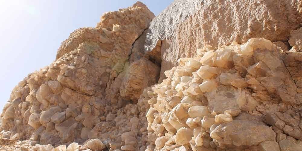 Glittering quartz crystal formations covering the rocky slopes of Crystal Mountain in Egypt’s Western Desert.