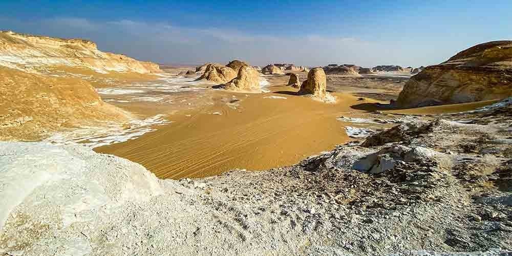 Surreal white limestone formations rising from the desert floor in Egypt’s White Desert.